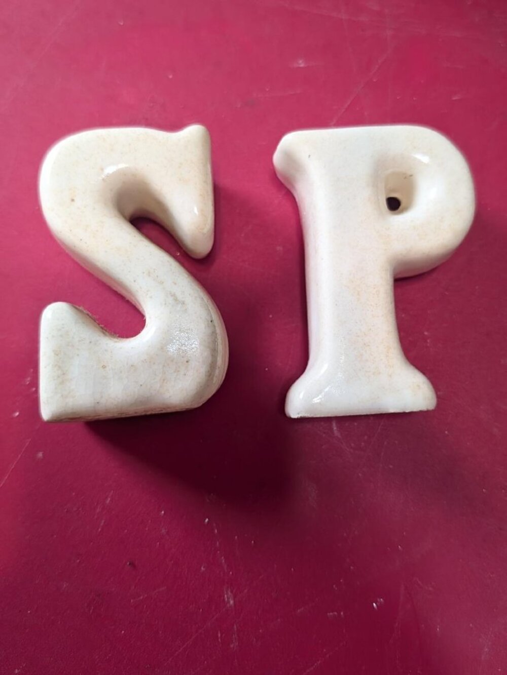 Ceramic novelty salt and pepper shaker set shaped as letters 'S' and 'P'